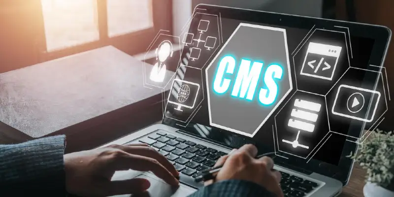 Cms concept person hand using laptop computer with content management system icon on virtual screen background business web computer website administration